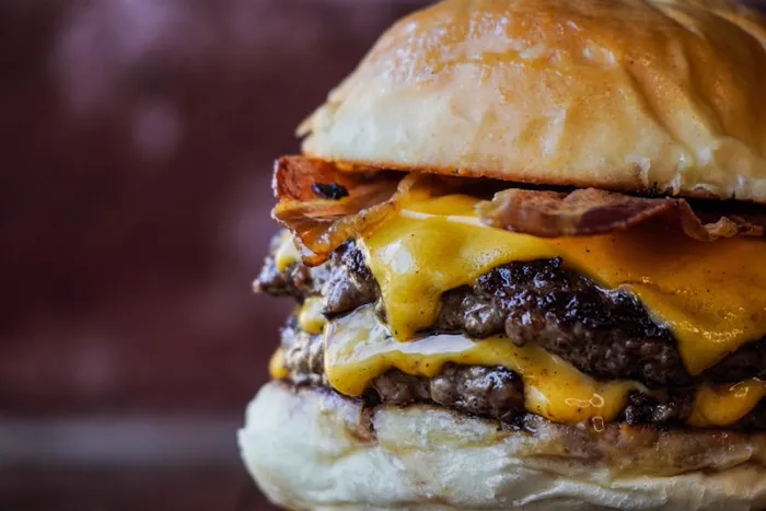 Smash burger with melted cheese and bacon